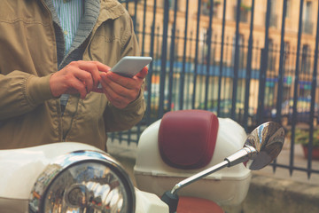 Man using cellphone outdoors.