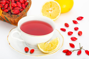 Dog rose, Rose hips red tea with lemon.Rosa canina hips in the basket.