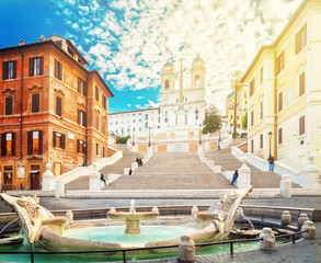 famous Spanish Steps with fountain with sunshine, Rome, Italy
