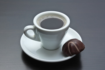 cup of coffee and chocolate candy