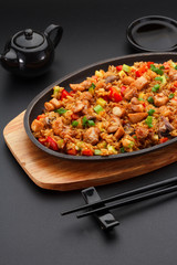 Japanese cuisine. Rice with chicken and vegetables.