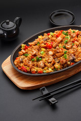 Japanese cuisine. Rice with chicken and vegetables.