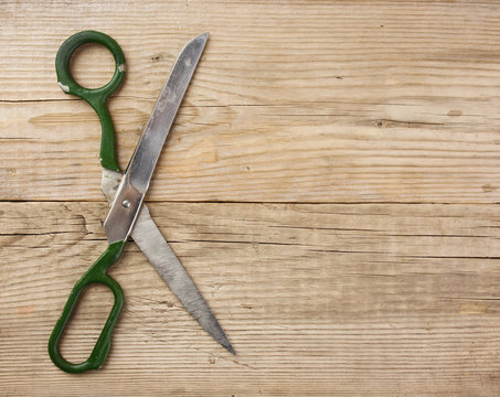old tailor scissors  on the wooden background