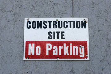 NO parking in front of construction site entrance sign
