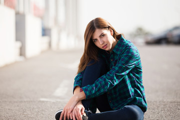 Urban fashionable girl posing outdoors in the city