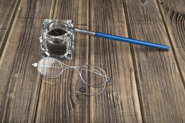 old glasses and pen