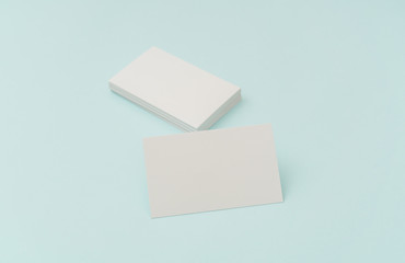 Blank business card on blue background .