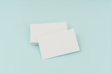 Blank business card on blue background .