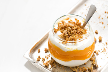dessert with pumpkin, whipped cream and cookies, top view