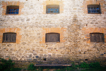 Six windows on old building