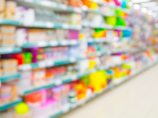 Blurred colorful supermarket products on shelves