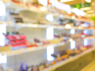 Abstract blurred supermarket aisle with colorful shelves