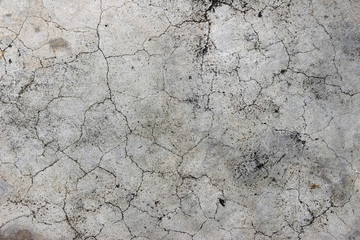 Aged cracked concrete stone plaster wall background and texture