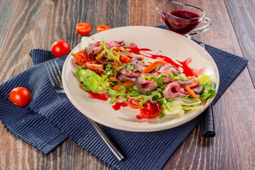 Vegetable salad with beef meat in restaurant