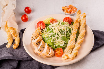 Healthy green organic caesar salad with cheese and croutons