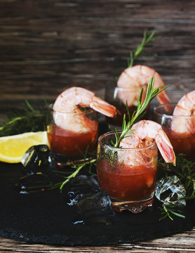 appetizer of shrimp cocktail with rosemary and sauce, selective focus