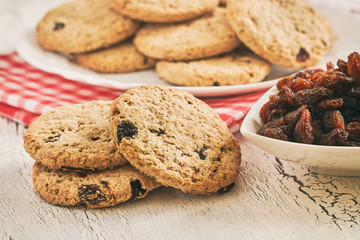 Wholewheat biscuits with raisins on white rustic table