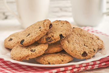 Wholewheat biscuits with raisins on white rustic table