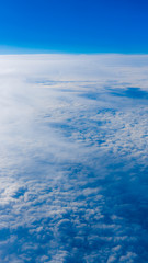 Naklejka na ściany i meble clouds from airplane window. height of 10 000 km. Clouds