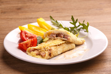 Fried asian egg rolls with pepper ant tomato