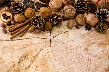 Christmas decoration with different nuts and cinnamon sticks.