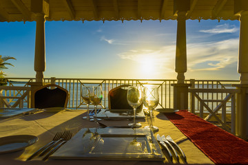festive table in the gazebo at sunset