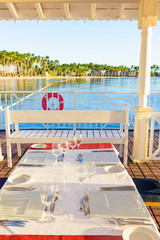 festive table in the gazebo at sunset