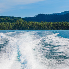 Water stream after speed boat.  Trail on water surface behind of
