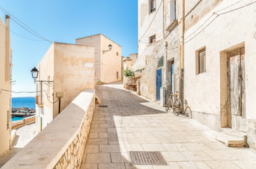 Fototapeta na wymiar Typical street of small village on Levanzo island, the smallest of the Egadi, Trapani, Italy 