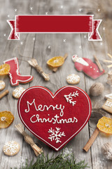 Christmas heart shaped gingerbread background. Winter holidays atmosphere. Snoflakes. Hand drawn ribbon for copy.Perfect for greeting cards, flyers, etc.Written in english