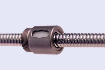 Steel rod with a screw thread and a metal round detail