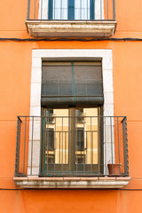Vintage window with shutters outdoors view