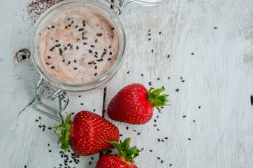 Homemade yogurt in a jar with strawberry