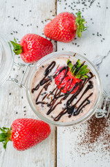 Homemade yogurt in a jar with strawberry