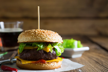Cheeseburger on a wooden table