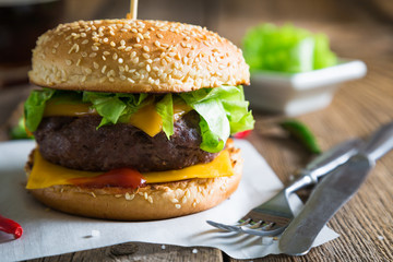 Cheeseburger on a wooden table