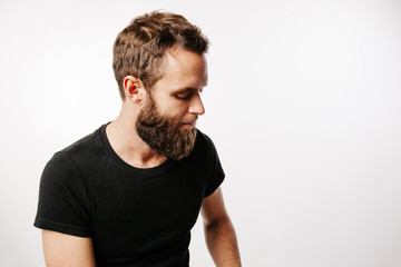 Obraz premium Bearded man looking down portrait
