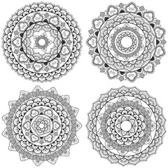 vector illustration set of four flower mandalas pretty sophisticated East lace pattern black on white