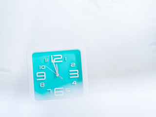 Clock and gentle fabrics background. Concepts and ideas for countdown time.