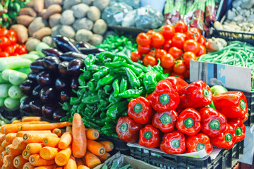 Naklejka na ściany i meble Fresh ripe vegetables on shelves in market