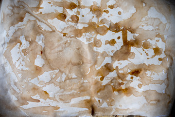 Background of old stained paper with coffee cup stains