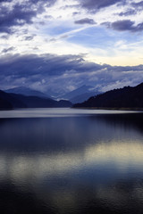 Fototapeta na wymiar Landscape with dam lake Vidraru in Romanian mountains, in the wi