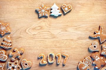 Merry Christmas and Happy new year! Homemade cookies on wooden background. Top view.