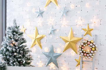 Fototapeta premium Christmas morning. The light room with Christmas scenery and a fir-tree. New Year scene.