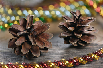 Christmas decoration with lights and fir cones