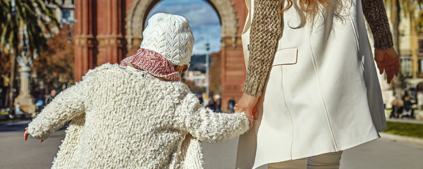 modern mother and daughter in Barcelona, Spain walking