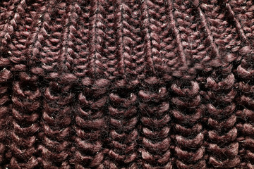 Background of warm women's sweater, with unusual patterns, warm and fluffy.