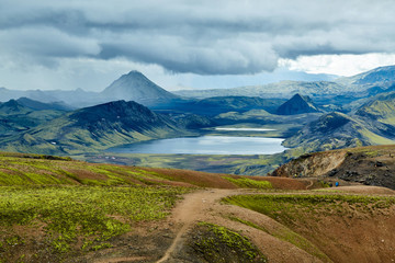 Fototapeta na wymiar Valley National Park Landmannalaugar. Magnificent Iceland in the August. beautiful valley between the mountains and the smooth mountain lake