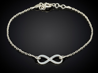 Golden necklace isolated on black background