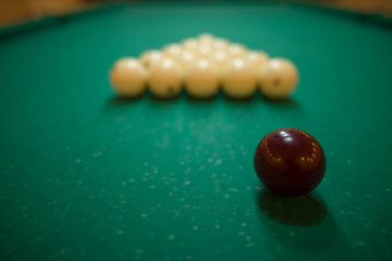 billiard balls on green baize in the game of pyramid